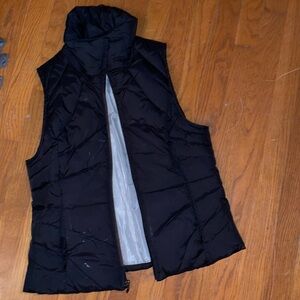 Kenneth Cole reaction black puffer white marks can be removed with eraser